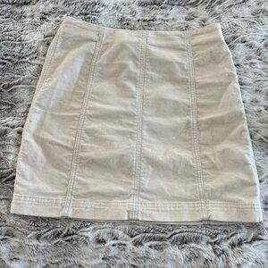 Free people cream colored mini skirt. Stretchy . Size 2. So cute 💕